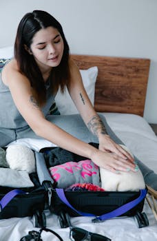 Woman organizing clothes in suitcase, preparing for travel.