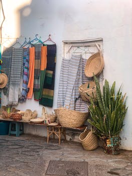 Colorful scarfs and handmade baskets displayed in Asilah, Morocco.