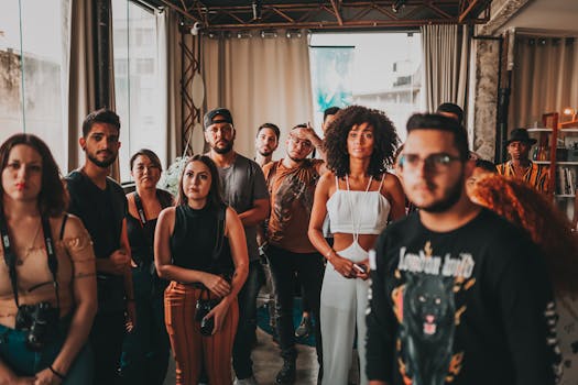 Vibrant and diverse group gathering at an indoor event in São Paulo, fostering interaction and collaboration.